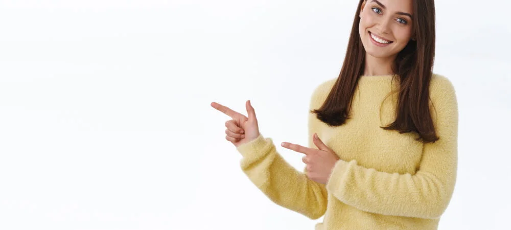 friendly-looking-female-student-showing-you-way-pointing-fingers-up-promo-banner-blank-white-copy-space-your-ad-as-give-recommendation-1000x450