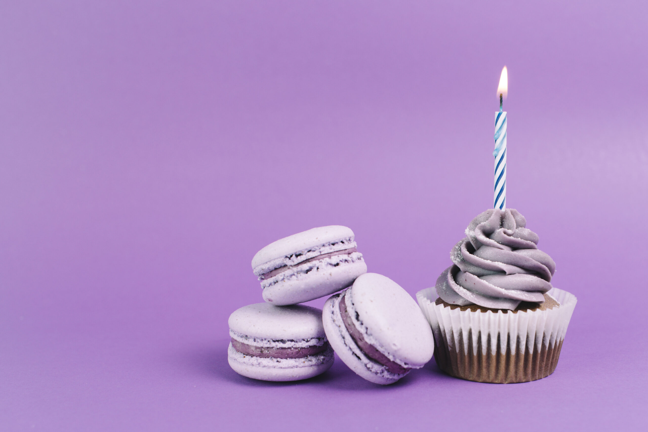 macaroons-near-cupcake-with-candle